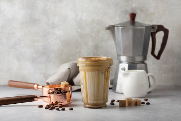 Free Photo delicious coffee with milk and  sugar cubes