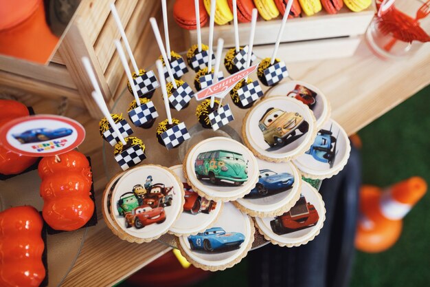 "Delicious cookies and candies on plate"