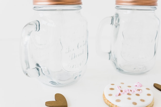 Free Photo delicious cookies and glass jar on white surface