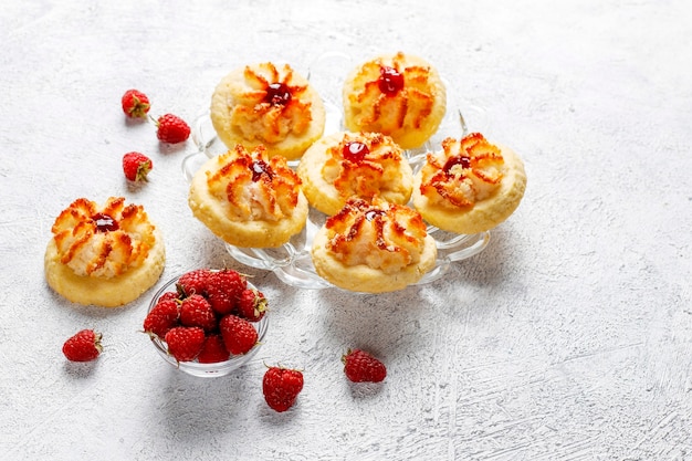 Delicious cookies with raspberry jam and fresh raspberries.