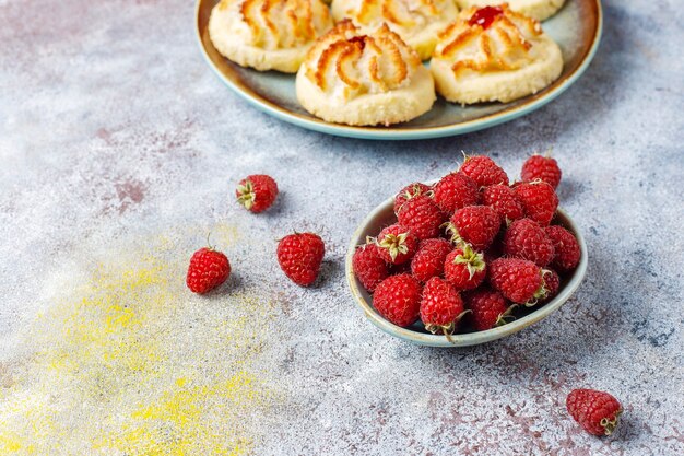 Delicious cookies with raspberry jam and fresh raspberries.