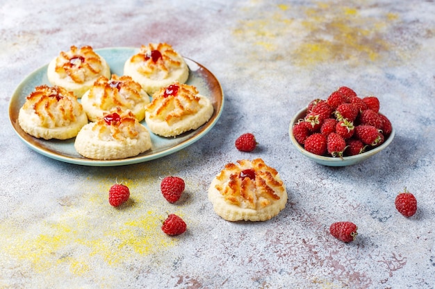 Delicious cookies with raspberry jam and fresh raspberries.