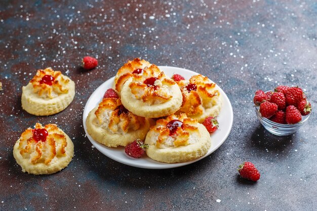 Delicious cookies with raspberry jam and fresh raspberries.