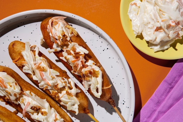 Free photo delicious corn dogs on plate top view