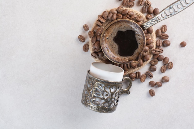 Free Photo delicious cup of aroma fresh cup of coffee with coffee beans . high quality photo