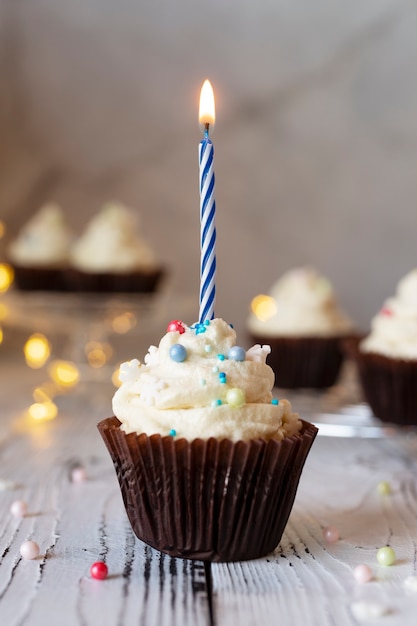 Delicious cupcake with candle