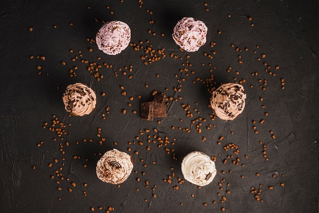 Delicious cupcakes arranged in circular shape with chocolate chips