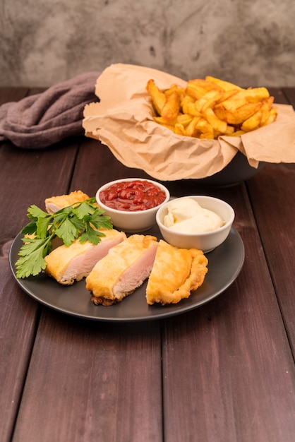 Delicious fast food plate with french fries