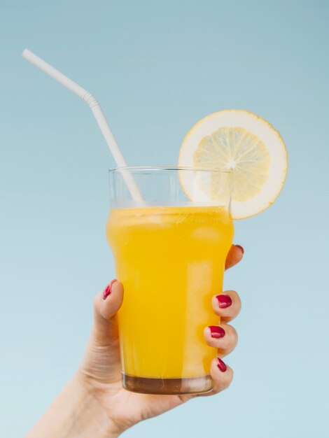 Delicious fresh natural fruit of orange and a straw