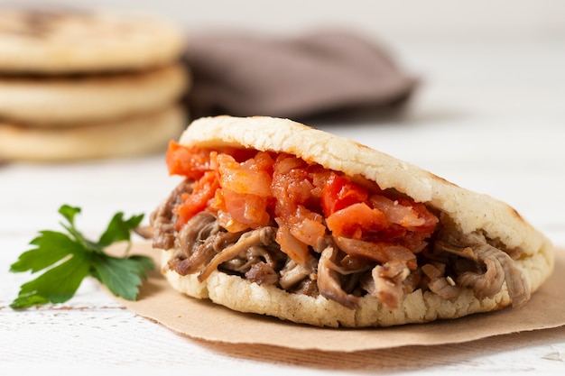 Delicious grilled arepas with meat