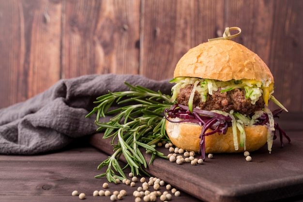 Delicious hamburger in front of wooden wall