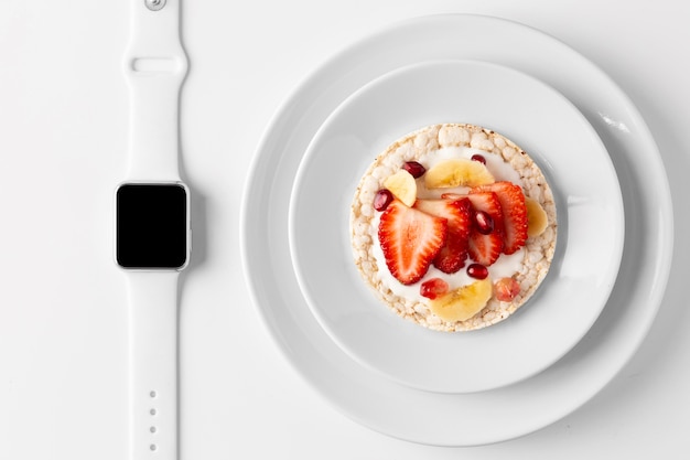 Delicious healthy snack and smartwatch