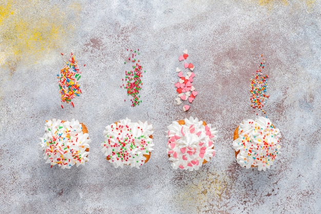 Delicious homemade cupcakes with various  sprinkles