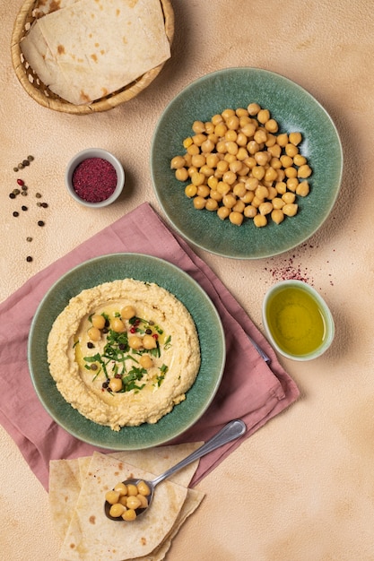 Free photo delicious hummus on plate still life flat lay