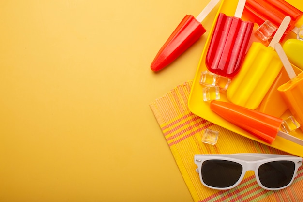 Free photo delicious ice cream pop stickles with sunglasses