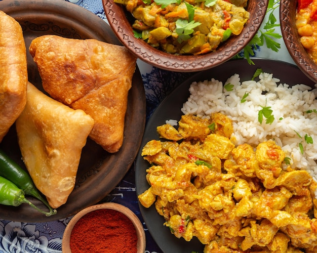 Delicious indian food on tray flat lay