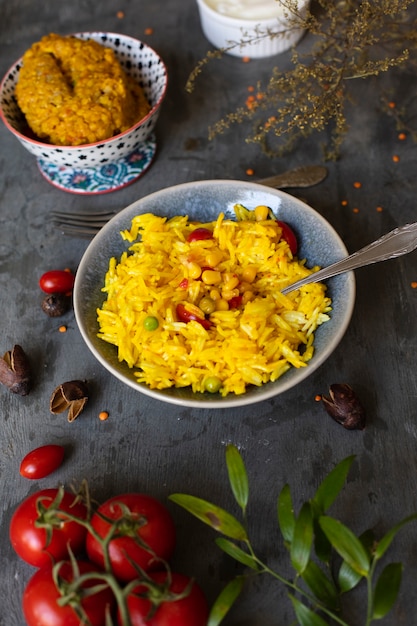 Free Photo delicious indian meal with rice and tomatoes