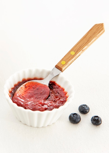 Delicious jam with spoon high view