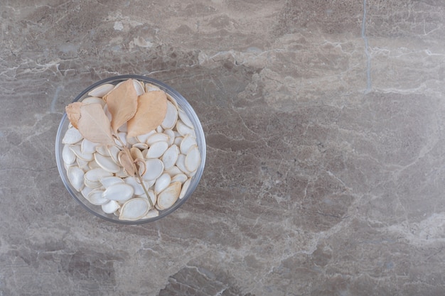 Delicious kernel and leaves on the marble surface