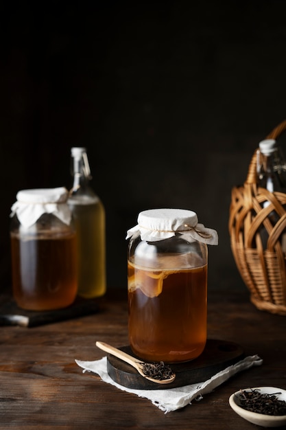 Free photo delicious kombucha bottles and jars assortment