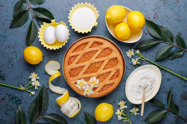 Delicious lemon pie with fresh lemons ,top view