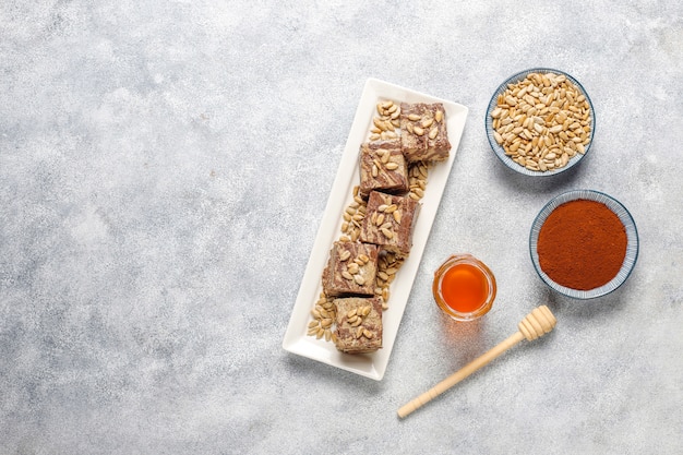 Delicious marble halva with sunflower seeds, cocoa powder and honey, top view