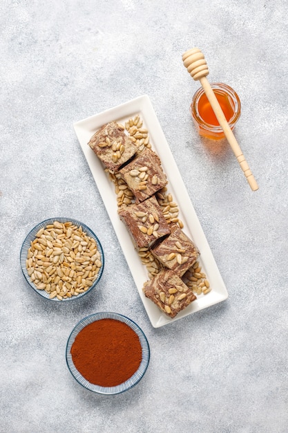 Delicious marble halva with sunflower seeds, cocoa powder and honey, top view