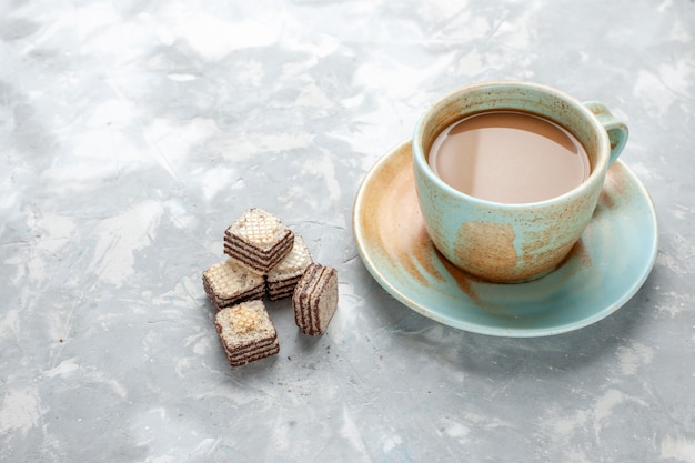 delicious milk coffee with chocolate waffles on light desk, chocolate cookie sweet sugar