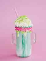 Free photo delicious milkshake on pink background