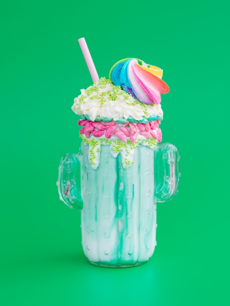 Free photo delicious milkshake with green background