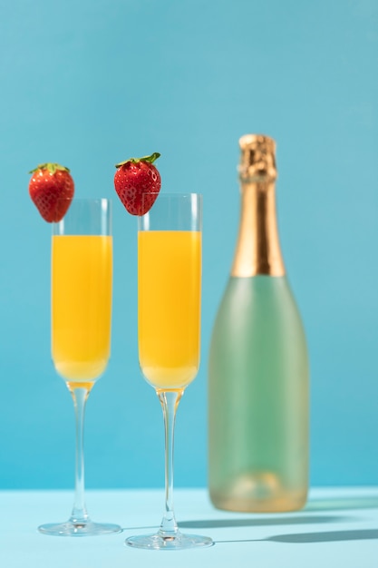 Delicious mimosa glasses with strawberries