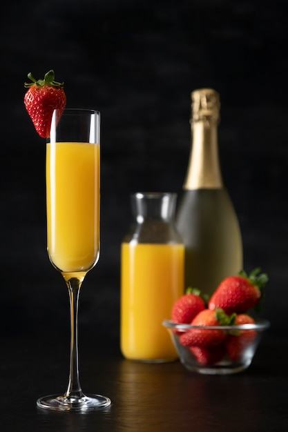 Delicious mimosa tall glass with strawberry