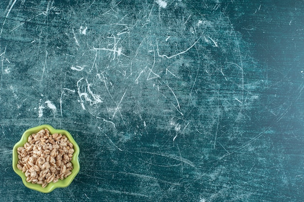 Free photo delicious muesli in a bowl , on the blue background. high quality photo