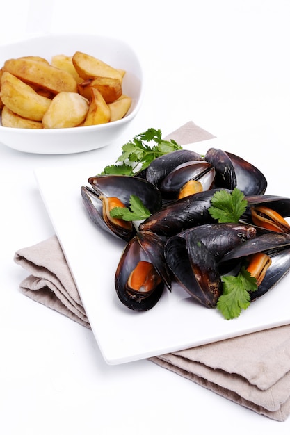 Delicious mussels on white