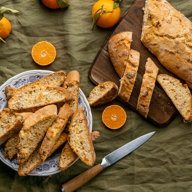 Delicious orange bun on table