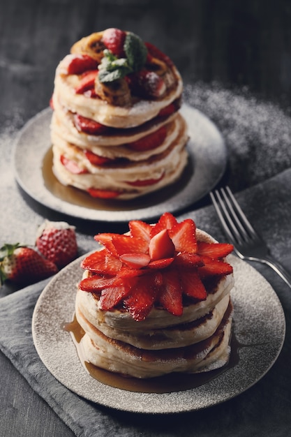 Delicious pancakes with fruit and honey