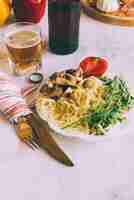 Free photo delicious pasta dish with fork and knife