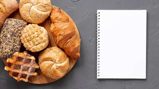 Delicious pastry products and a notebook