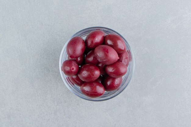 Delicious pickled plum in a glass bowl    