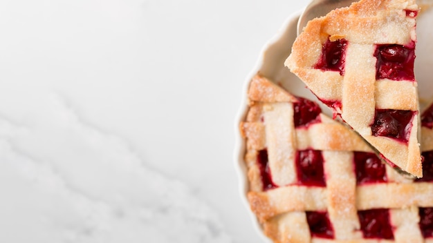 Delicious pie with strawberry jam and copy space