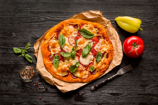 Delicious pizza concept on wooden table