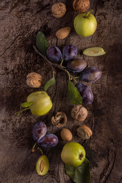 Delicious plums arrangement flat lay