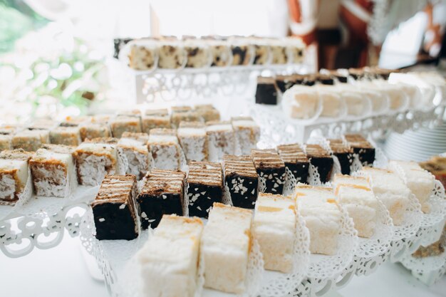 Delicious portion sweets are served on layered stands