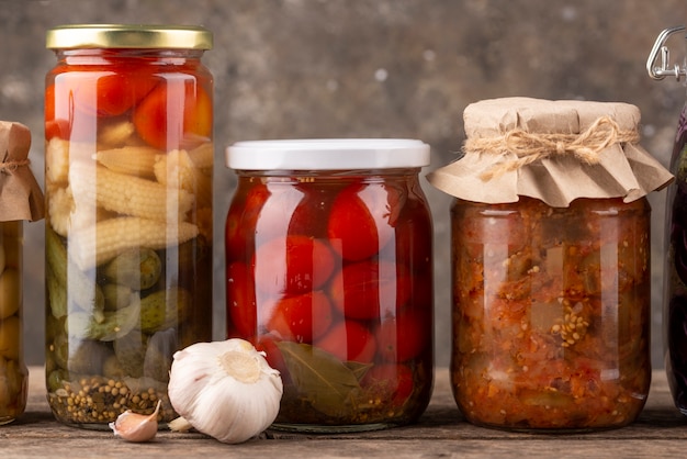 Free photo delicious preserved food in jars arrangement