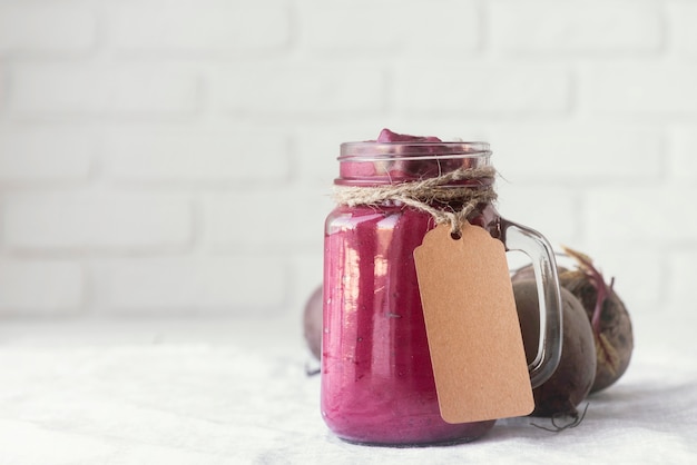 Free photo delicious purple smoothie in jar mug