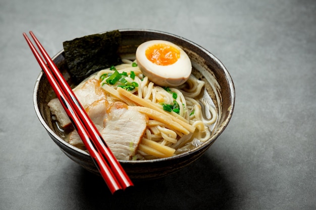 Delicious ramen on dark surface