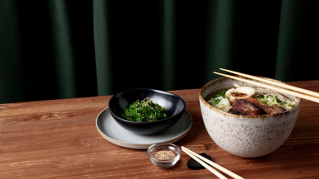 Delicious ramen with seaweed salad concept