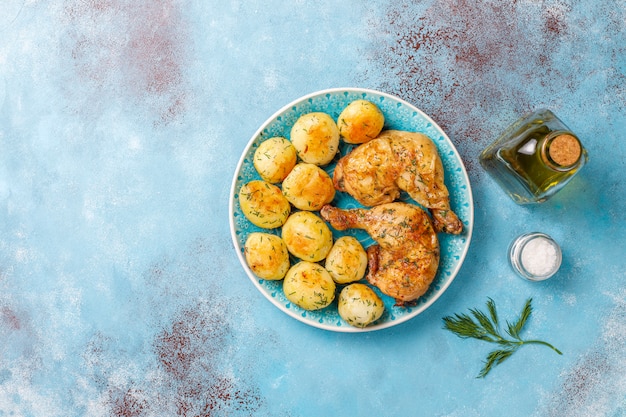 Free Photo delicious roasted young potatoes with dill and chicken,top view