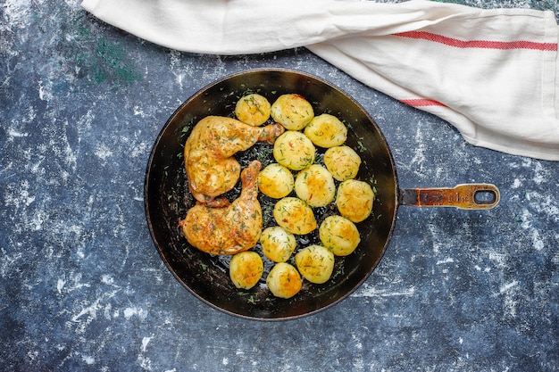 Free Photo delicious roasted young potatoes with dill and chicken, top view