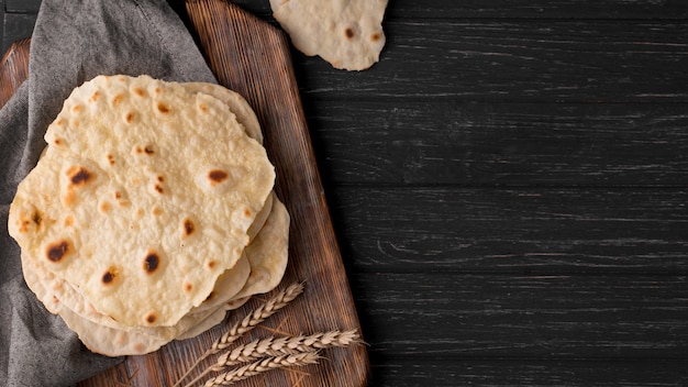 Delicious roti arrangement on the table with copy space